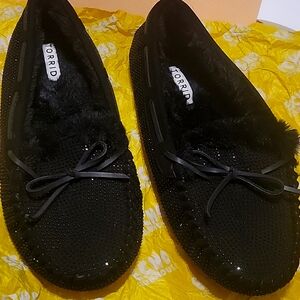 Torrid fur lined cozy moccasins with like a sequin design and leather tie on top